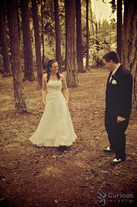 bride and groom meet in forest. processed color, antique, anticipation